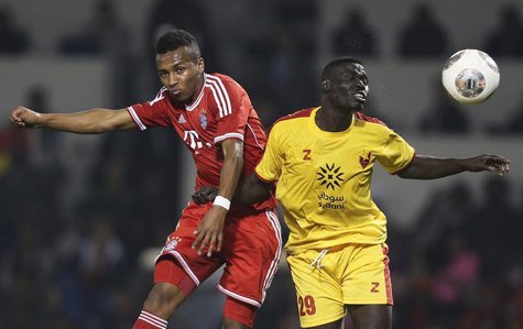 Bayern Munich's Julian Green (L) fights for the ball with Al-Merrikh's Ramadan Ajab during their friendly soccer match in Doha January 9, 20 Bayern Munich's Julian Green (L) fights for the ball with Al-Merrikh's Ramadan Ajab during their friendly soccer match in Doha January 9, 20