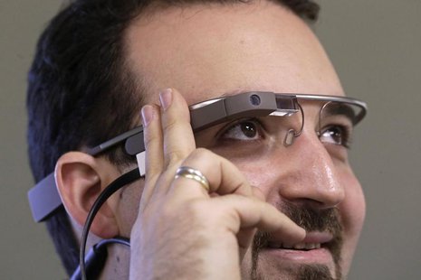 Developer Maximiliano Firtman wears the prototype device Google Glass before a news conference ahead of the 2013 RigaComm event in Riga Nove Developer Maximiliano Firtman wears the prototype device Google Glass before a news conference ahead of the 2013 RigaComm event in Riga Nove