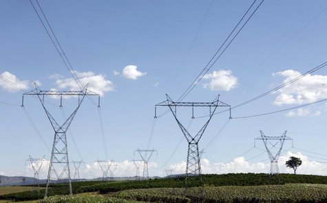 Electricity transmission towers stand over a coffee farm in Santo Antonio do Jardim February 6, 2014. REUTERS/Paulo Whitaker Electricity transmission towers stand over a coffee farm in Santo Antonio do Jardim February 6, 2014. REUTERS/Paulo Whitaker
