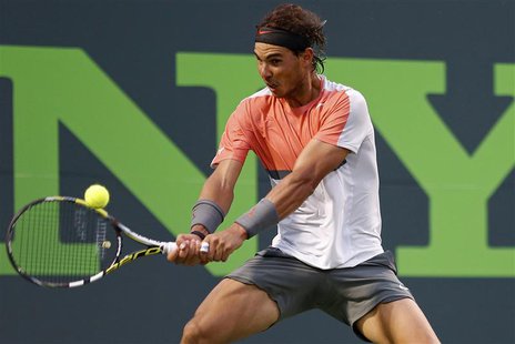 Rafael Nadal hits a backhand against Denis Istomin (not pictured) on day eight of the Sony Open at Crandon Tennis Center. Nadal won 6-1, 6-0 Rafael Nadal hits a backhand against Denis Istomin (not pictured) on day eight of the Sony Open at Crandon Tennis Center. Nadal won 6-1, 6-0
