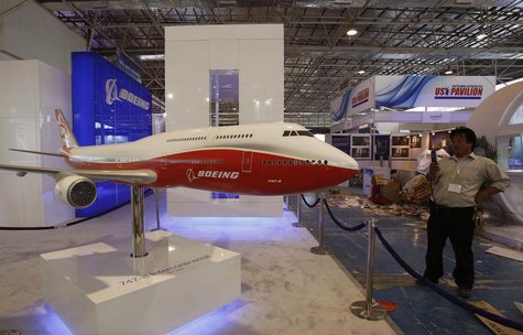 A visitor takes a photo of a 1:20 scaled model of Boeing 747-8 Intercontential passenger plane being displayed at the China International Av A visitor takes a photo of a 1:20 scaled model of Boeing 747-8 Intercontential passenger plane being displayed at the China International Av