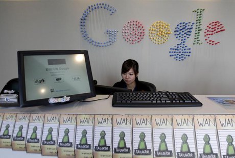 An employee sits behind a reception desk during a media tour in the Google data centre in Changhua Coastal Industrial Park, central Taiwan, An employee sits behind a reception desk during a media tour in the Google data centre in Changhua Coastal Industrial Park, central Taiwan,