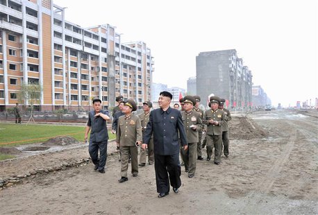North Korean leader Kim Jong-un inspects the construction site of the apartment houses for scientists close to completion in this undated fi North Korean leader Kim Jong-un inspects the construction site of the apartment houses for scientists close to completion in this undated fi