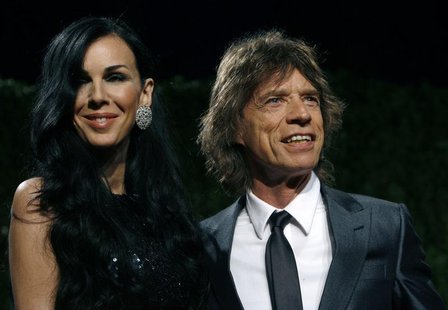 Designer L'Wren Scott and rock musician Mick Jagger pose as they arrive at the 2009 Vanity Fair Oscar Party in West Hollywood, California Fe Designer L'Wren Scott and rock musician Mick Jagger pose as they arrive at the 2009 Vanity Fair Oscar Party in West Hollywood, California Fe