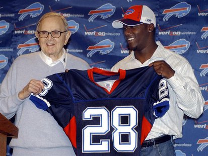 Buffalo Bills owner Ralph Wilson (L) appears during a news conference with Bills NFL first round draft pick Leodis McKelvin, a defensive bac Buffalo Bills owner Ralph Wilson (L) appears during a news conference with Bills NFL first round draft pick Leodis McKelvin, a defensive bac