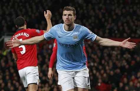 Manchester City's Edin Dzeko celebrates his second goal against Manchester United during their English Premier League soccer match at Old Tr Manchester City's Edin Dzeko celebrates his second goal against Manchester United during their English Premier League soccer match at Old Tr