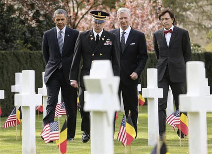 U.S. President Barack Obama (L), Belgium's King Philippe (2nd R) and Belgium's Prime Minister Elio Di Rupo (R) visit the Flanders Field Amer U.S. President Barack Obama (L), Belgium's King Philippe (2nd R) and Belgium's Prime Minister Elio Di Rupo (R) visit the Flanders Field Amer