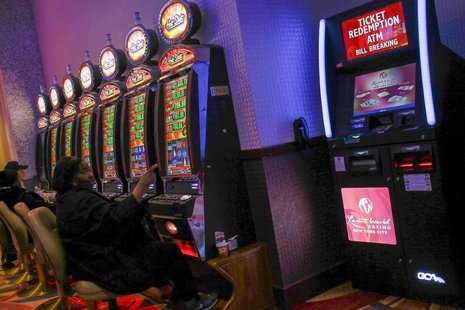 People play at slot machines inside Resorts World Casino, owned by Malaysian gaming company Genting, in the Queens borough of New York, Nove People play at slot machines inside Resorts World Casino, owned by Malaysian gaming company Genting, in the Queens borough of New York, Nove