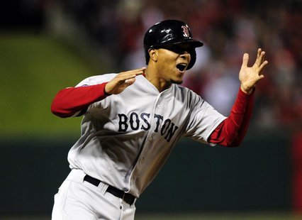Oct 28, 2013; St. Louis, MO, USA; Boston Red Sox third baseman Xander Bogaerts (72) reacts as he runs home on a catcher David Ross (3) groun Oct 28, 2013; St. Louis, MO, USA; Boston Red Sox third baseman Xander Bogaerts (72) reacts as he runs home on a catcher David Ross (3) groun