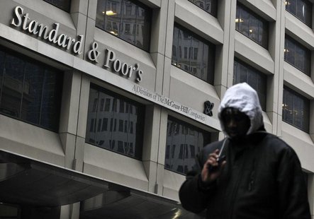 A man walks past the Standard & Poor's building in New York's financial district February 5, 2013. REUTERS/Brendan McDermid A man walks past the Standard & Poor's building in New York's financial district February 5, 2013. REUTERS/Brendan McDermid