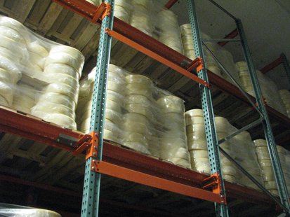 Cheese wheels in cold storage Cheese wheels in cold storage