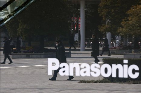 People are reflected in a sign at Panasonic Center Tokyo in Tokyo March 12, 2014. REUTERS/Toru Hanai People are reflected in a sign at Panasonic Center Tokyo in Tokyo March 12, 2014. REUTERS/Toru Hanai