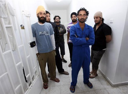 Crew members of the tanker Morning Glory which was seized by U.S. forces after loading oil at a Libyan port held by anti-government rebels, Crew members of the tanker Morning Glory which was seized by U.S. forces after loading oil at a Libyan port held by anti-government rebels,