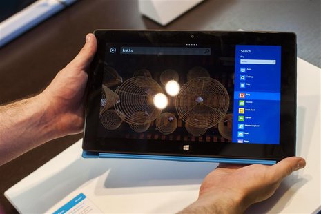 Sales staff demonstrate the Microsoft Surface during the opening of Microsoft's retail store in New York's Times Square October 25, 2012. RE Sales staff demonstrate the Microsoft Surface during the opening of Microsoft's retail store in New York's Times Square October 25, 2012. RE