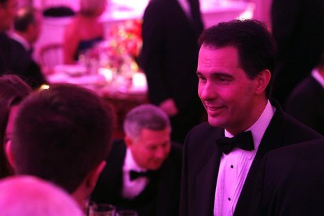 Wisconsin Governor Scott Walker (R-WI) (R) greets fellow guests before the 2014 Governors' Dinner in the State Dining Room of the White Hous Wisconsin Governor Scott Walker (R-WI) (R) greets fellow guests before the 2014 Governors' Dinner in the State Dining Room of the White Hous