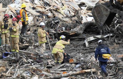 Rescue workers look for victims in the mudslide near Oso, Washington March 26, 2014.
CREDIT: REUTERS/RICK WILKING Rescue workers look for victims in the mudslide near Oso, Washington March 26, 2014.
CREDIT: REUTERS/RICK WILKING
