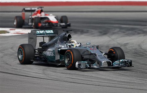 Mercedes Formula One driver Lewis Hamilton of Britain takes a corner during the first practice session of the Malaysian F1 Grand Prix at Sep Mercedes Formula One driver Lewis Hamilton of Britain takes a corner during the first practice session of the Malaysian F1 Grand Prix at Sep