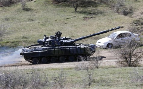 A tank, believed to be Russian, drives outside a military base in Perevalnoye, near the Crimean city of Simferopol, March 27, 2014. REUTERS/ A tank, believed to be Russian, drives outside a military base in Perevalnoye, near the Crimean city of Simferopol, March 27, 2014. REUTERS/