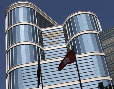 A Hong Kong flag (R) flutters outside CITIC Tower, the corporate headquarters of CITIC Pacific Ltd in Hong Kong March 27, 2014. REUTERS/Bobb A Hong Kong flag (R) flutters outside CITIC Tower, the corporate headquarters of CITIC Pacific Ltd in Hong Kong March 27, 2014. REUTERS/Bobb