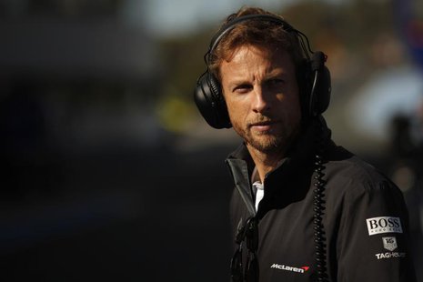 McLaren Formula One driver Jenson Button of Britain stands in the pit lane during pre-season testing at the Jerez racetrack in southern Spai McLaren Formula One driver Jenson Button of Britain stands in the pit lane during pre-season testing at the Jerez racetrack in southern Spai