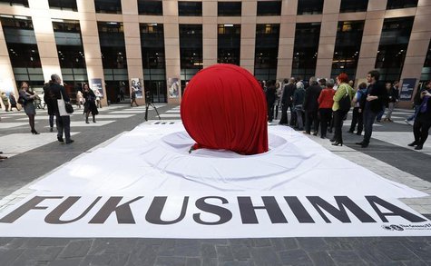 A banner that reads "Fukushima" is placed in front of a giant symbolic Japan's national flag to mark the third year anniversary of the March A banner that reads "Fukushima" is placed in front of a giant symbolic Japan's national flag to mark the third year anniversary of the March