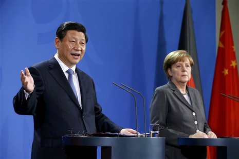 German Chancellor Angela Merkel and China's President Xi Jinping address a joint news conference after an agreement signing, at the Chancell German Chancellor Angela Merkel and China's President Xi Jinping address a joint news conference after an agreement signing, at the Chancell