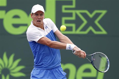 Mar 27, 2014; Miami, FL, USA; Tomas Berdych hits a backhand against Alexandr Dolgopolov (not pictured) on day eleven of the Sony Open at Cra Mar 27, 2014; Miami, FL, USA; Tomas Berdych hits a backhand against Alexandr Dolgopolov (not pictured) on day eleven of the Sony Open at Cra
