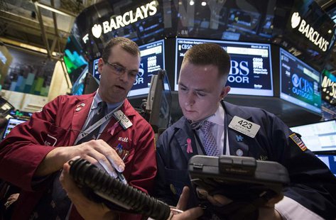Traders William Lawrence and Justin Flinn (R) work on the floor of the New York Stock Exchange March 28, 2014. REUTERS/Brendan McDermid Traders William Lawrence and Justin Flinn (R) work on the floor of the New York Stock Exchange March 28, 2014. REUTERS/Brendan McDermid