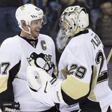 Mar 28, 2014; Columbus, OH, USA; Pittsburgh Penguins center Sidney Crosby (87) celebrates with goalie Marc-Andre Fleury (29) after defeating Mar 28, 2014; Columbus, OH, USA; Pittsburgh Penguins center Sidney Crosby (87) celebrates with goalie Marc-Andre Fleury (29) after defeating