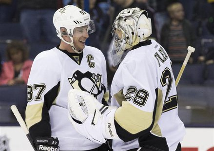 Mar 28, 2014; Columbus, OH, USA; Pittsburgh Penguins center Sidney Crosby (87) celebrates with goalie Marc-Andre Fleury (29) after defeating Mar 28, 2014; Columbus, OH, USA; Pittsburgh Penguins center Sidney Crosby (87) celebrates with goalie Marc-Andre Fleury (29) after defeating
