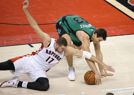 Mar 28, 2014; Toronto, Ontario, CAN; Boston Celtics forward Kris Humphries (43) wins a battle for the ball against Toronto Raptors center Jo Mar 28, 2014; Toronto, Ontario, CAN; Boston Celtics forward Kris Humphries (43) wins a battle for the ball against Toronto Raptors center Jo