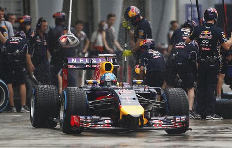 Red Bull Formula One driver Sebastian Vettel of Germany leaves his team garage during the qualifying session for the Malaysian F1 Grand Prix Red Bull Formula One driver Sebastian Vettel of Germany leaves his team garage during the qualifying session for the Malaysian F1 Grand Prix