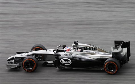 McLaren Formula One driver Jenson Button of Britain drives during the third practice session of the Malaysian F1 Grand Prix at Sepang Intern McLaren Formula One driver Jenson Button of Britain drives during the third practice session of the Malaysian F1 Grand Prix at Sepang Intern
