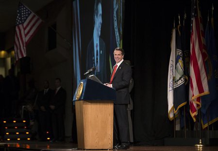 New York State Governor Andrew Cuomo smiles as he pauses during his fourth State of the State address from the New York State Capitol in Alb New York State Governor Andrew Cuomo smiles as he pauses during his fourth State of the State address from the New York State Capitol in Alb