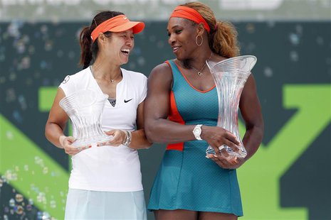 Mar 29, 2014; Miami, FL, USA; Serena Williams (right) holds the championship trophy as Li Na (left) holds the runner-up trophy after the fin Mar 29, 2014; Miami, FL, USA; Serena Williams (right) holds the championship trophy as Li Na (left) holds the runner-up trophy after the fin