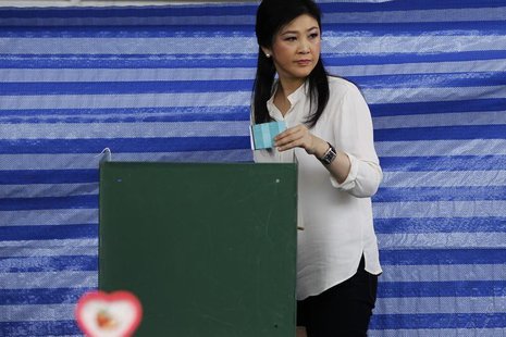 Thai Prime Minister Yingluck Shinawatra prepares to cast a ballot at a polling station in Bangkok March 30, 2014. REUTERS/Chaiwat Subprasom Thai Prime Minister Yingluck Shinawatra prepares to cast a ballot at a polling station in Bangkok March 30, 2014. REUTERS/Chaiwat Subprasom
