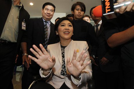 Thai Prime Minister Yingluck Shinawatra reacts as she leaves the National Anti-Corruption Commission office in Nonthaburi province, on the o Thai Prime Minister Yingluck Shinawatra reacts as she leaves the National Anti-Corruption Commission office in Nonthaburi province, on the o
