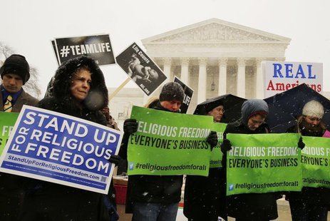 Protesters pray at the steps of the Supreme Court as arguments begin today to challenge the Affordable Care Act's requirement that employers Protesters pray at the steps of the Supreme Court as arguments begin today to challenge the Affordable Care Act's requirement that employers