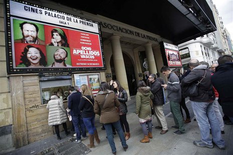 People stand in line to buy tickets for the film "8 Apellidos Vascos" (8 Basque Surnames) at a cinema in central Madrid March 30, 2014. REUT People stand in line to buy tickets for the film "8 Apellidos Vascos" (8 Basque Surnames) at a cinema in central Madrid March 30, 2014. REUT