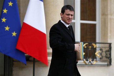 French Interior Minister Manuel Valls leaves after the weekly cabinet meeting at the Elysee Palace in Paris in this February 19, 2014 file p French Interior Minister Manuel Valls leaves after the weekly cabinet meeting at the Elysee Palace in Paris in this February 19, 2014 file p