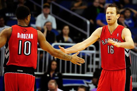 Mar 30, 2014; Orlando, FL, USA; Toronto Raptors guard DeMar DeRozan (10) celebrates with forward Steve Novak (16) against the Orlando Magic Mar 30, 2014; Orlando, FL, USA; Toronto Raptors guard DeMar DeRozan (10) celebrates with forward Steve Novak (16) against the Orlando Magic