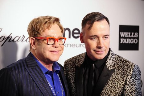 Musician Elton John (L) and his husband David Furnish pose at the 2014 Elton John AIDS Foundation Oscar Party in West Hollywood, California Musician Elton John (L) and his husband David Furnish pose at the 2014 Elton John AIDS Foundation Oscar Party in West Hollywood, California