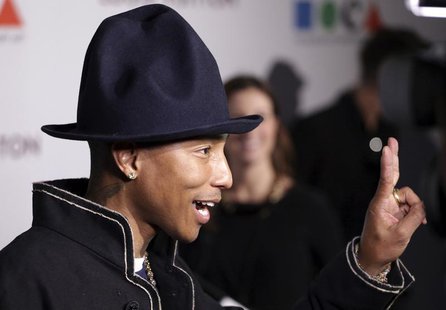 Singer Pharrell Williams gestures as he attends the Museum of Contemporary Art (MOCA)'s 35th Anniversary Gala presented by Louis Vuitton at Singer Pharrell Williams gestures as he attends the Museum of Contemporary Art (MOCA)'s 35th Anniversary Gala presented by Louis Vuitton at