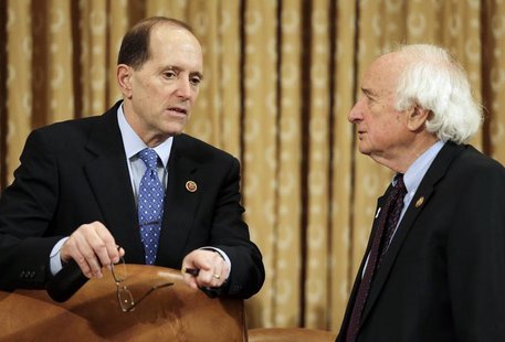 House Ways and Means Committee chair Rep. Dave Camp (R-MI) (L) confers with ranking member Rep. Sander Levin (D-MI) before their hearing on House Ways and Means Committee chair Rep. Dave Camp (R-MI) (L) confers with ranking member Rep. Sander Levin (D-MI) before their hearing on