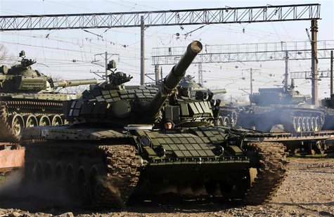 A T-72B Russian tank manouvers shortly after Russian tanks arrived at a train station in the Crimean settlement of Gvardeiskoye near the Cri A T-72B Russian tank manouvers shortly after Russian tanks arrived at a train station in the Crimean settlement of Gvardeiskoye near the Cri