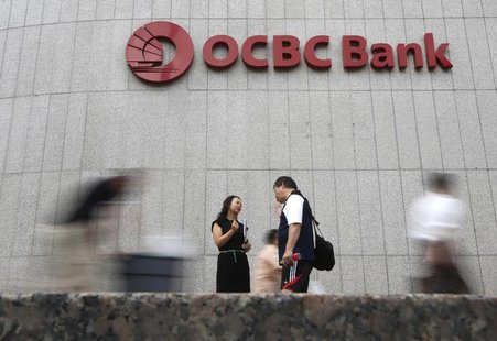 Office workers pass a logo of Overseas-Chinese Banking Corp Ltd (OCBC) at the company's headquarters in Singapore February 14, 2014. REUTERS Office workers pass a logo of Overseas-Chinese Banking Corp Ltd (OCBC) at the company's headquarters in Singapore February 14, 2014. REUTERS