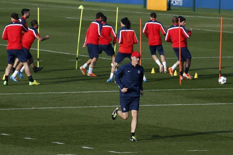 Paris St Germain coach Laurent Blanc (C) leads a training session at the Camp des Loges training center in Saint-Germain-en-Laye, near Paris Paris St Germain coach Laurent Blanc (C) leads a training session at the Camp des Loges training center in Saint-Germain-en-Laye, near Paris