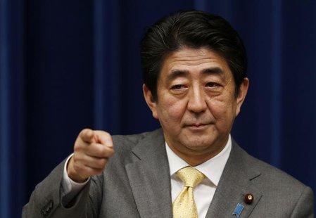 Japan's Prime Minister Shinzo Abe points to a reporter during a news conference at his official residence in Tokyo March 10, 2014, a day bef Japan's Prime Minister Shinzo Abe points to a reporter during a news conference at his official residence in Tokyo March 10, 2014, a day bef