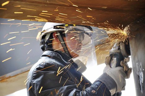 A labourer works inside a factory in Qingdao, Shandong province, February 15, 2014. REUTERS/China Daily A labourer works inside a factory in Qingdao, Shandong province, February 15, 2014. REUTERS/China Daily
