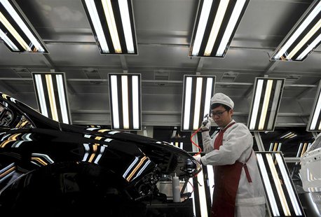 An employee works at a Chinese automobile factory in Hefei, Anhui province, in this file picture taken March 15, 2014. REUTERS/Stringer/File An employee works at a Chinese automobile factory in Hefei, Anhui province, in this file picture taken March 15, 2014. REUTERS/Stringer/File